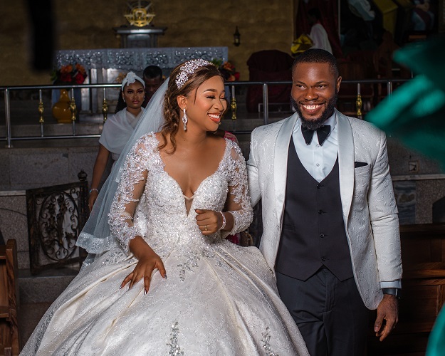 asastan white wedding photo styles 27 - the joy-filled couple posing for another shot inside the church after the wedding