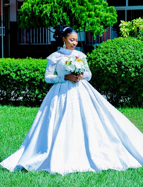 asabmc white wedding photo styles 2 - Queen Esther in white wedding gown, holding flower